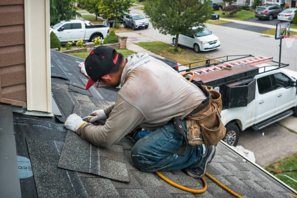 Professional Roof Repair technician working in Medford, NY